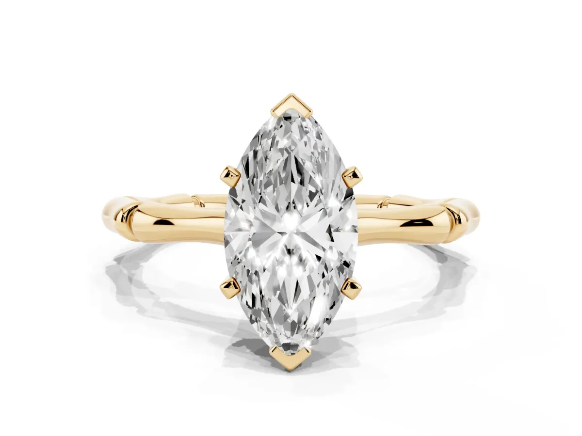 Marquise Cut Solitaire Diamond Ring with Bamboo Band and Four-Prong Setting Yellow gold