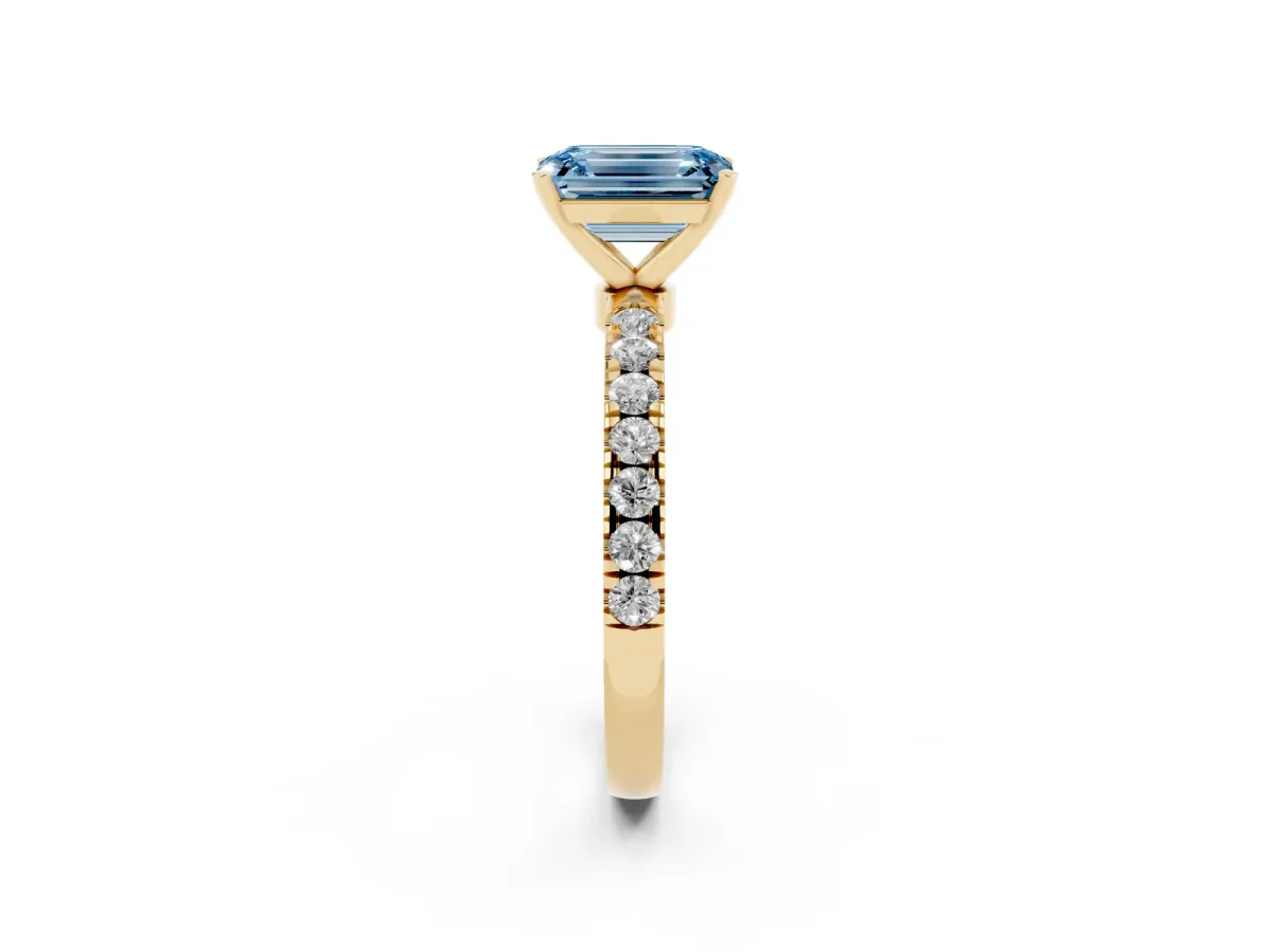Fancy Blue Emerald Cut Diamond Solitaire Ring with Pavé Accents and Four-Prong Setting Yellow gold