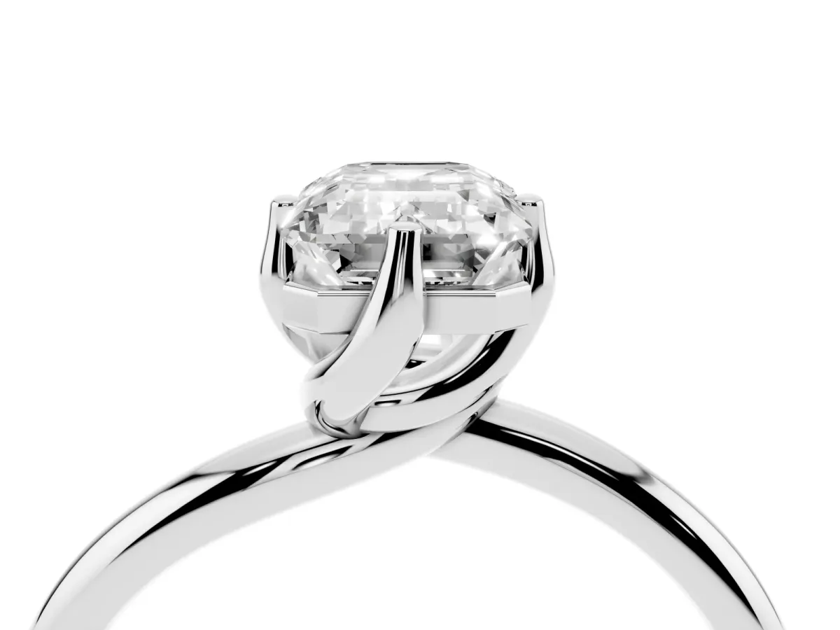 Emerald Cut Diamond Solitaire Engagement Ring with Four-Prong Setting and Classic Band Silver