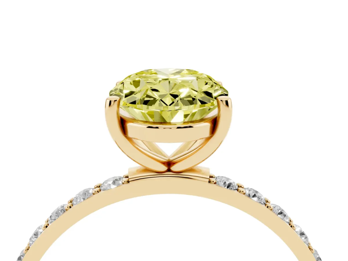 Fancy Yellow Oval Cut Diamond Solitaire Ring with Round Pavé Shoulders and Prong Setting Yellow gold