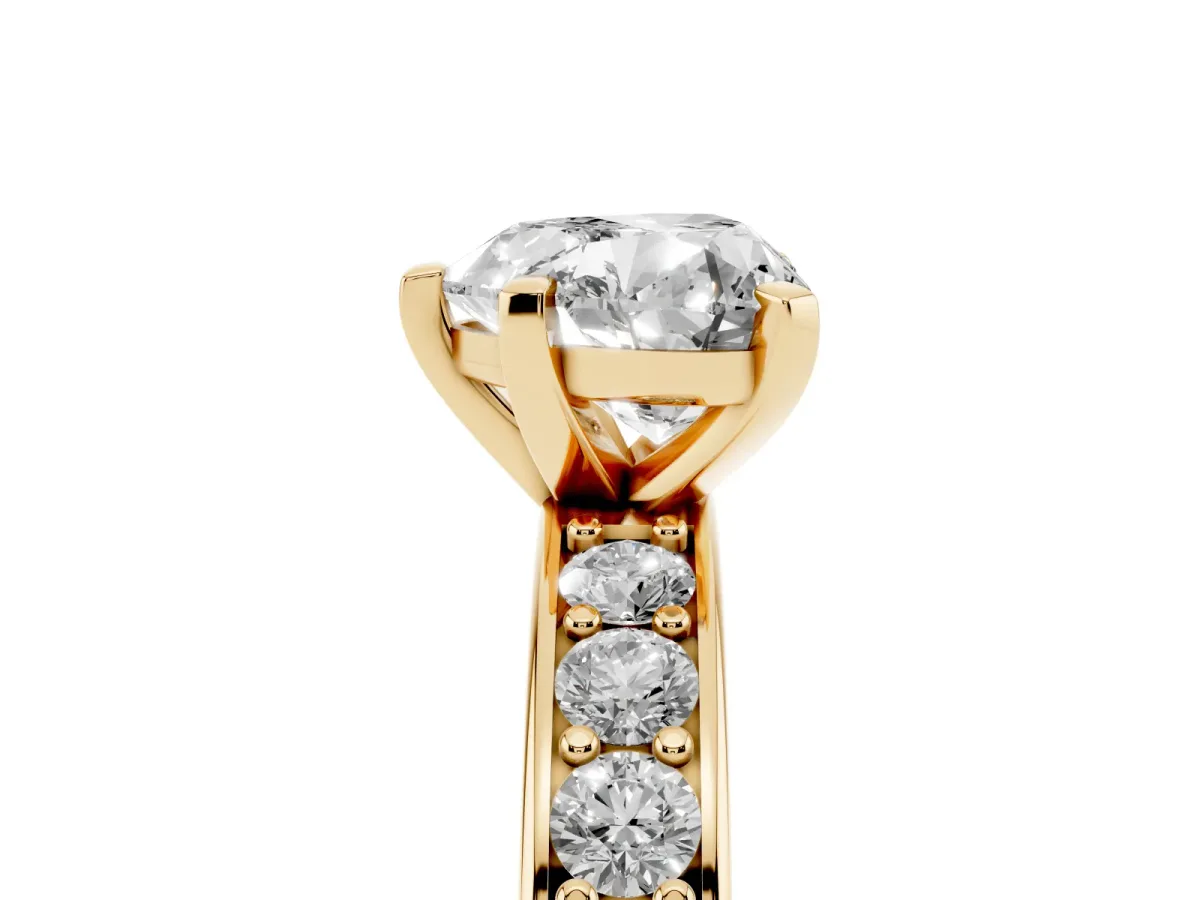 Heart Cut Diamond Engagement Ring with Channel Set Round Band and Prong Setting Yellow gold