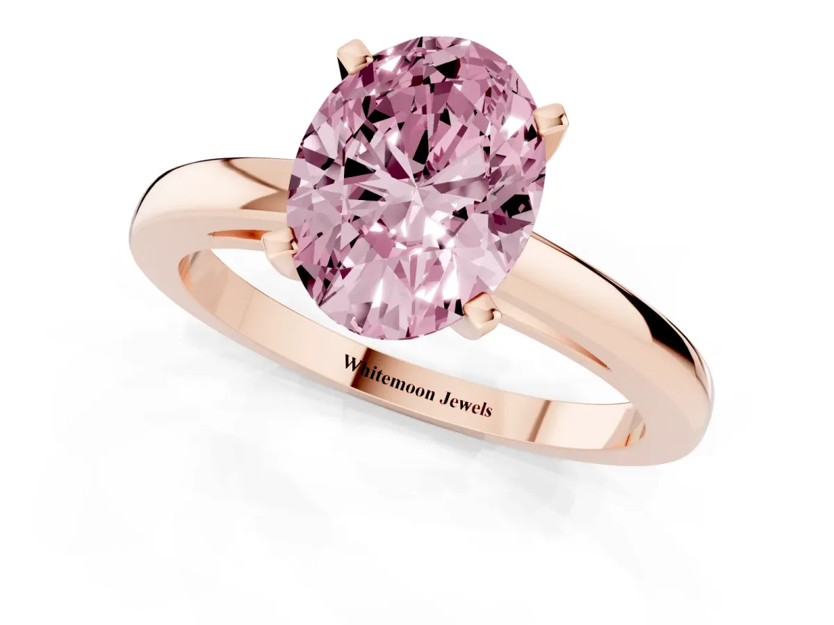 Fancy Pink Oval Cut Solitaire Diamond Engagement Ring with Four-Prong Setting on a Classic Band Rose gold