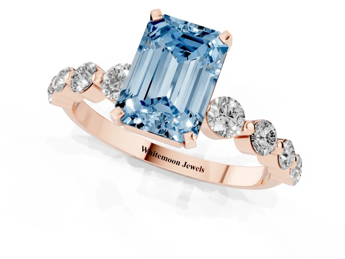Fancy Blue Emerald Cut Solitaire Diamond Ring with Pave Band and Four-Prong Setting Rose gold