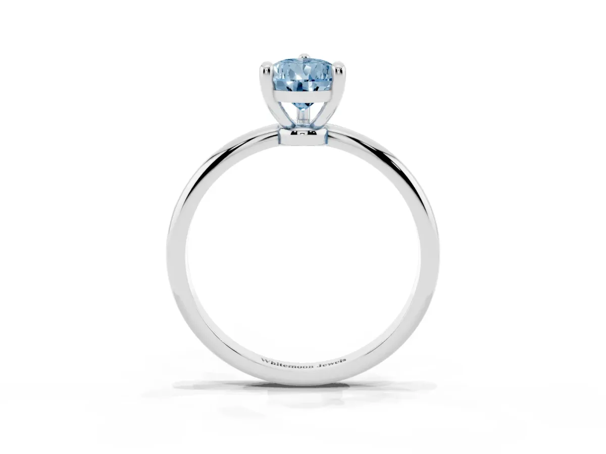 Fancy Blue Pear Cut Solitaire Diamond Ring with 4-Prong Setting on a Classic Band Silver