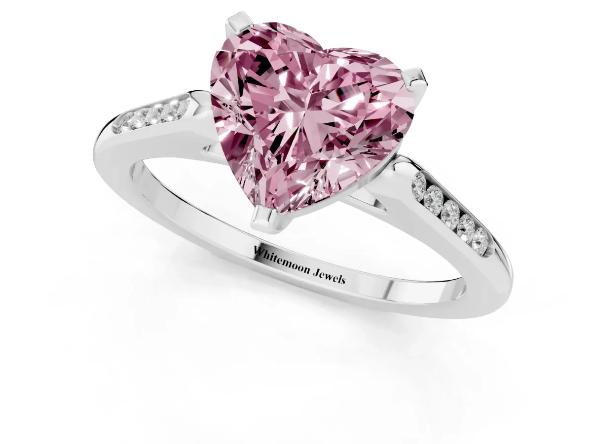 Fancy Pink Heart Cut Diamond Solitaire Ring with Channel Set Round Band and Prong Setting Silver