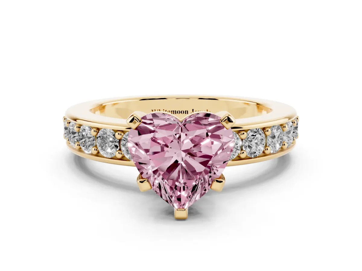 Fancy Pink Heart Cut Diamond Engagement Ring with Channel Set Round Band and Prong Setting Yellow gold