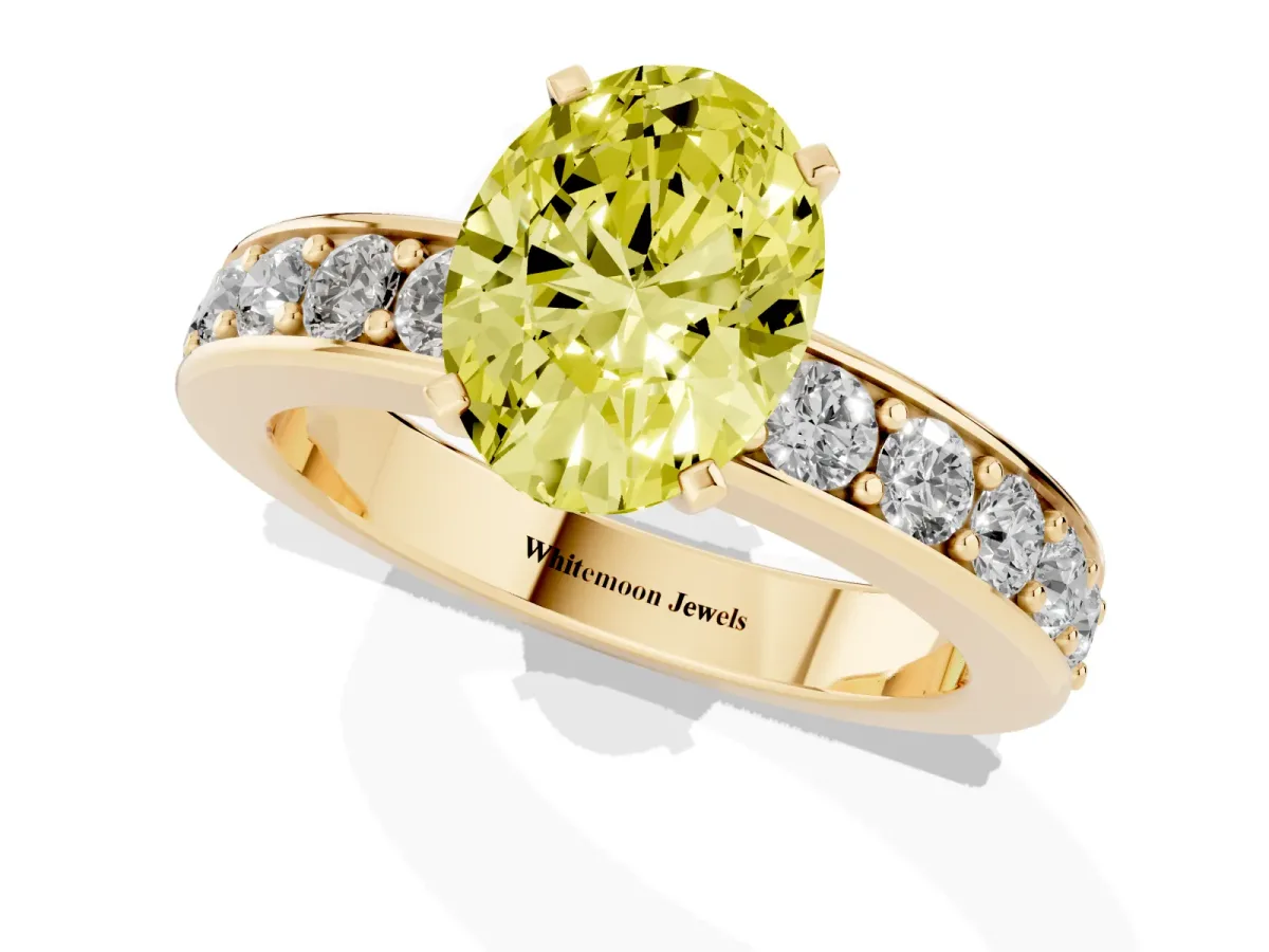 Fancy Yellow Oval Cut Diamond Engagement Ring with Channel Set Round Band and Prong Setting Yellow gold