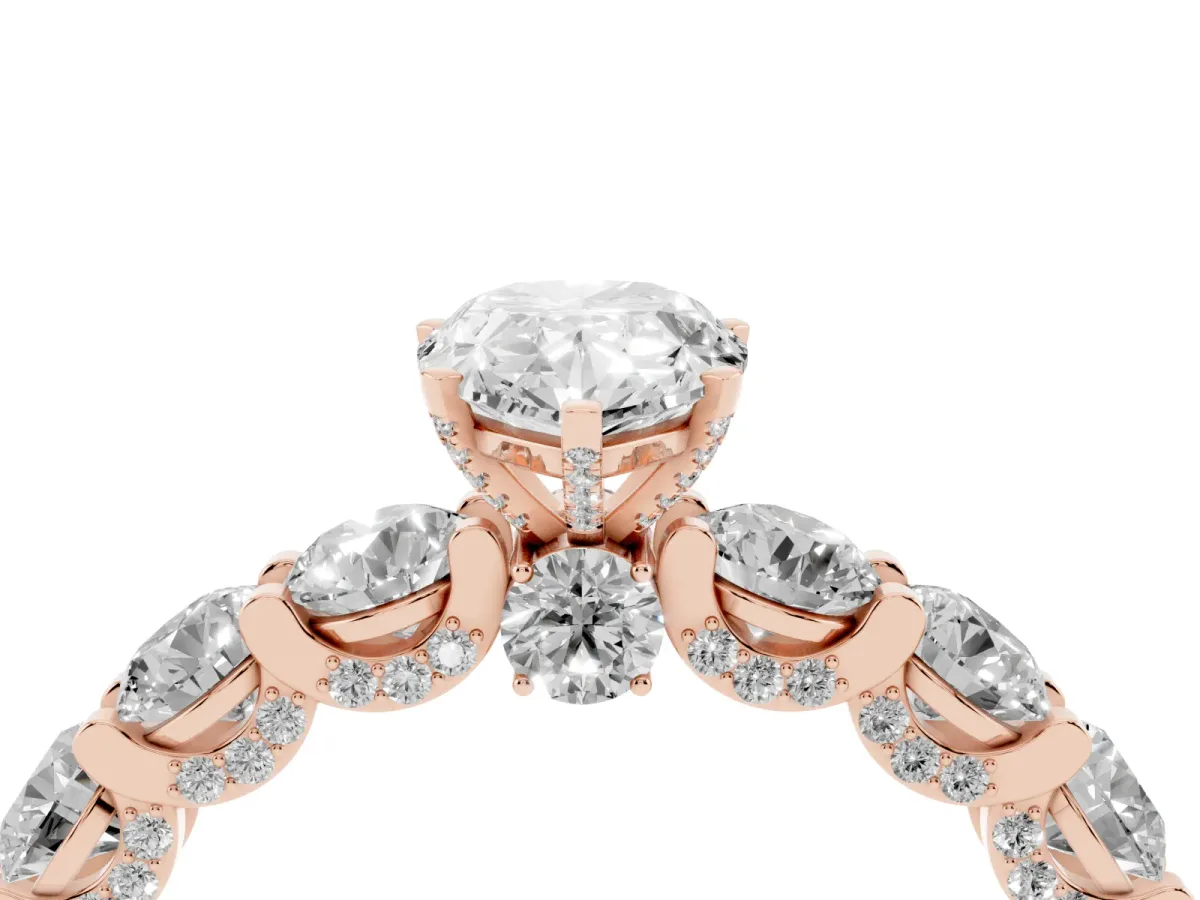 Pear Cut Diamond Side Stone Engagement Ring with Four-Prong Setting Rose gold