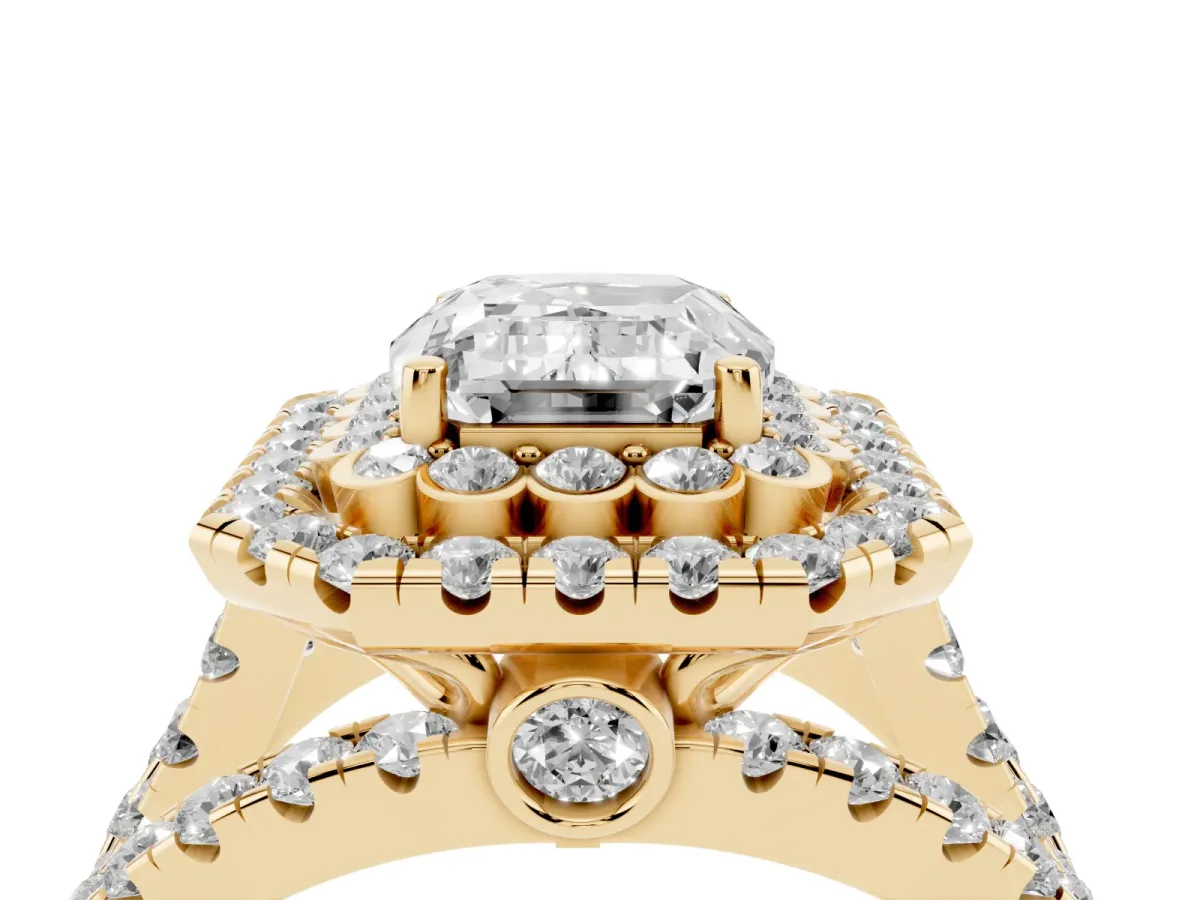 Emerald Cut Diamond Double Halo Ring with Round Pavé Split Shank and Prong Setting Yellow gold