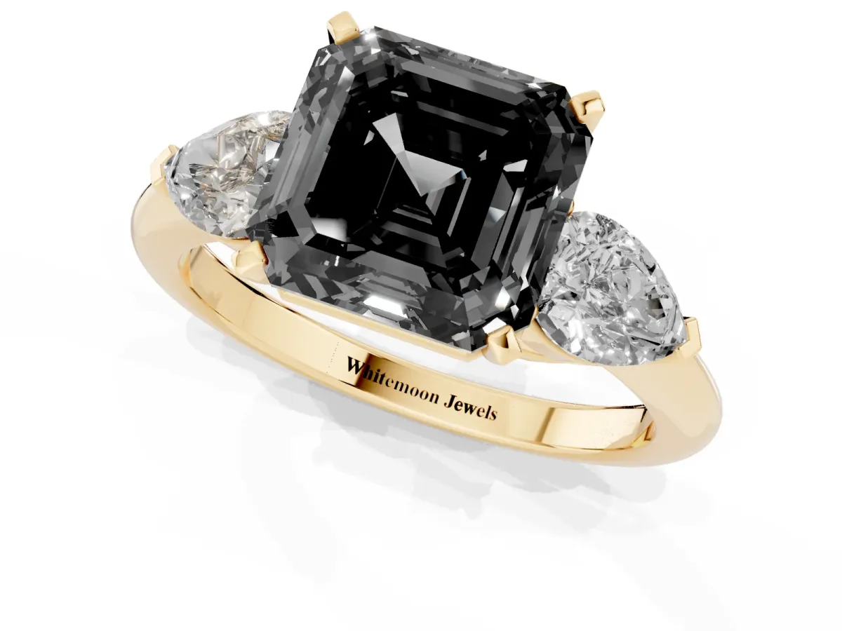 Fancy Black Three-Stone Asscher Cut Diamond Ring with Pear Side Stones and Four-Prong Setting Yellow gold