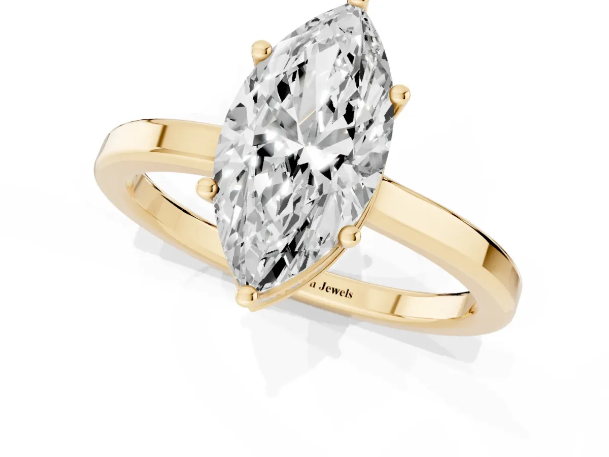 Marquise Cut Cut Solitaire Engagement Ring with Four-Prong Setting on a Classic Band Yellow gold
