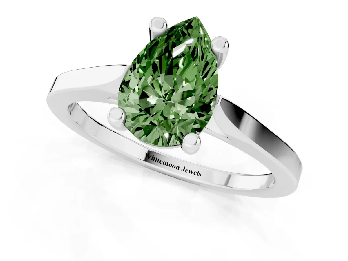 Fancy Green Pear Cut Solitaire Diamond Ring with Four-Prong Setting and Tapered Band Platinum