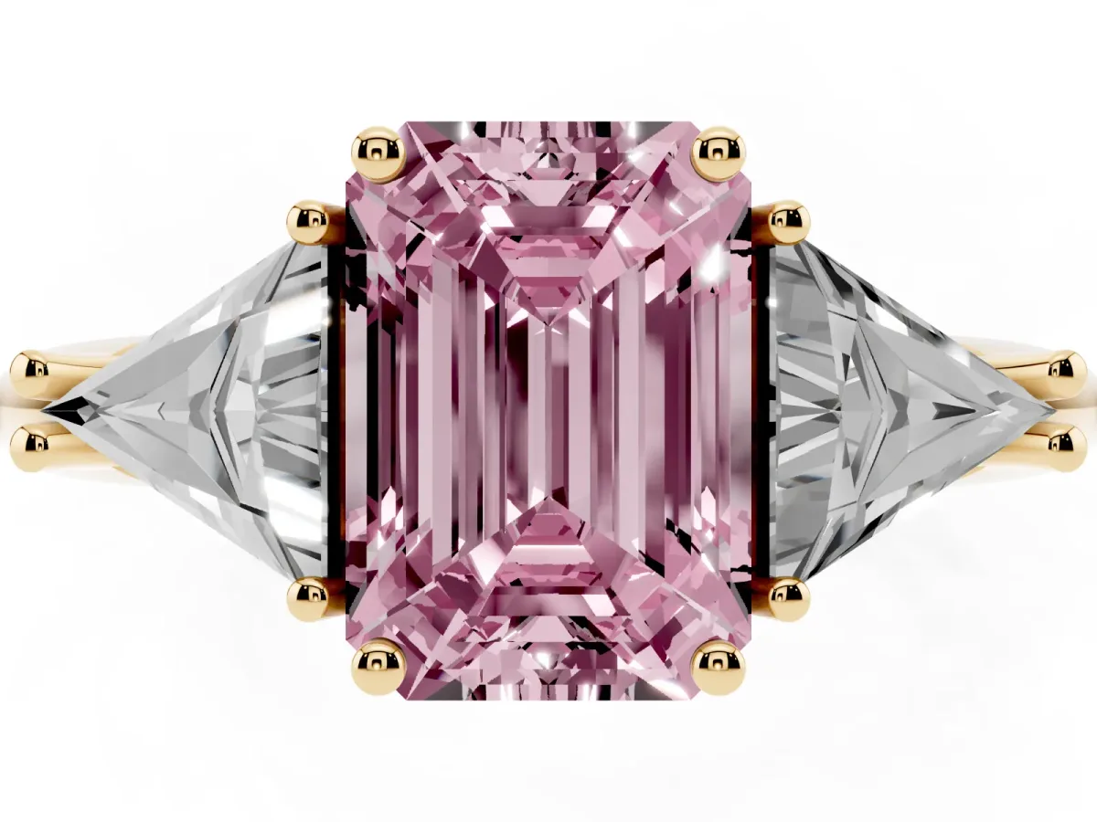 Fancy Pink Three-Stone Emerald Cut Diamond Engagement Ring with Trillion Side Stones and Prong Setting Yellow gold