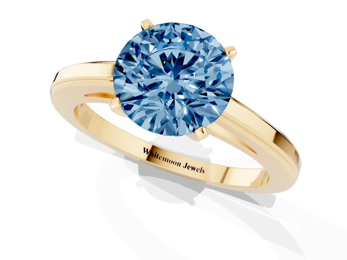 Fancy Blue Round Cut Solitaire Diamond Ring with Four-Prong Setting and Classic Band Yellow gold
