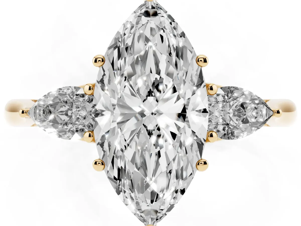 Marquise Cut Diamond Three-Stone Ring with Pear Side Stones and Prong Setting Yellow gold