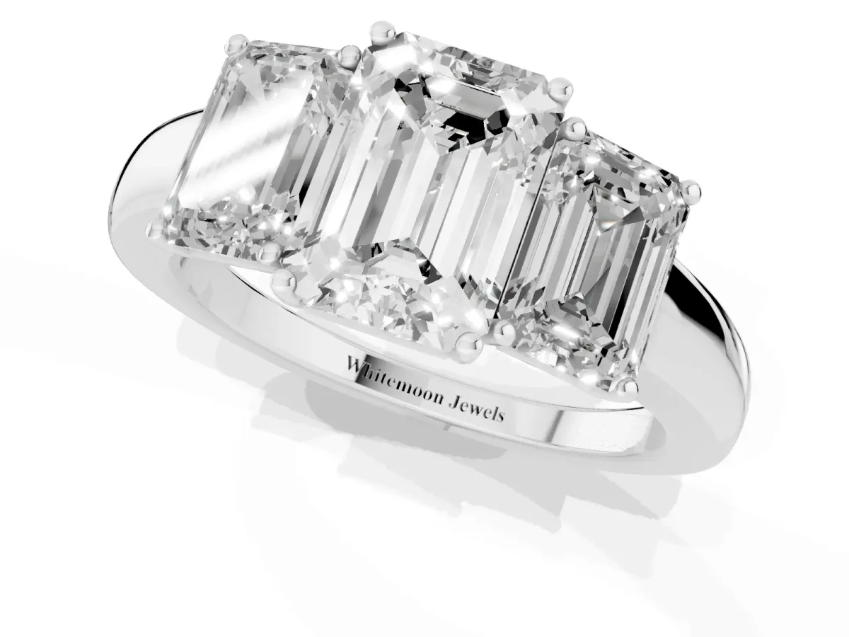 Emerald Cut Diamond Three-Stone Ring with Four-Prong Setting and Classic Band Platinum