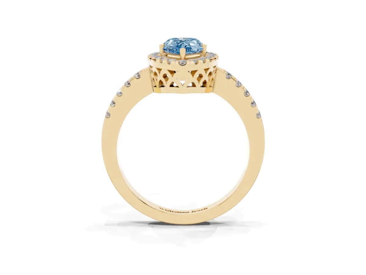 Fancy Blue Pear Cut Halo Diamond Engagement Ring with Pavé Band and Four-Prong Setting Yellow gold