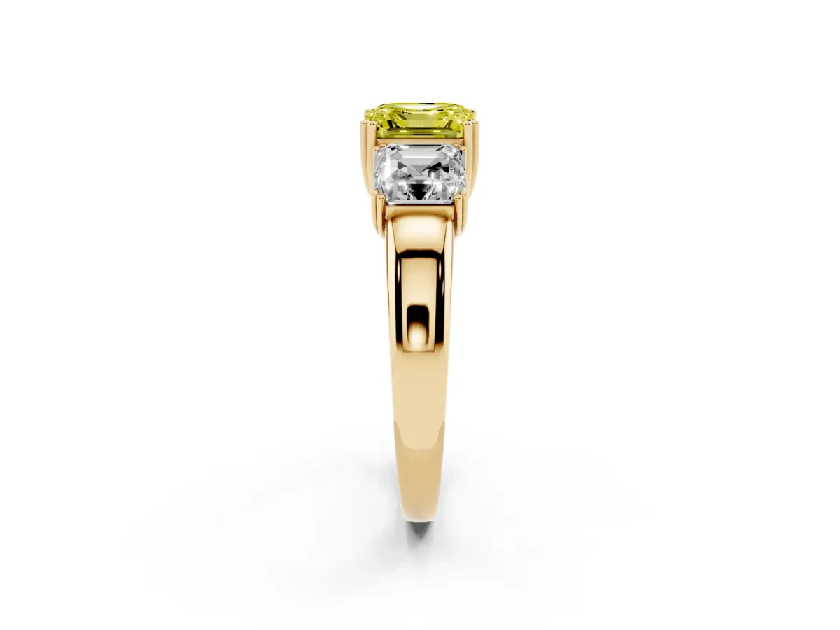 Fancy Yellow Three-Stone Asscher Cut Cut Diamond Ring with Channel Set Band and Four-Prong Setting Yellow gold
