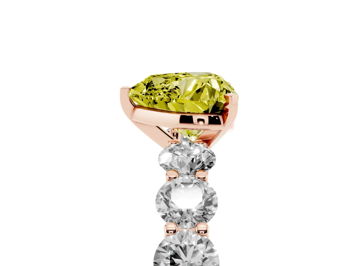 Fancy Yellow Heart Cut Diamond Prong Setting with Side Stones on a Pave Band Rose gold