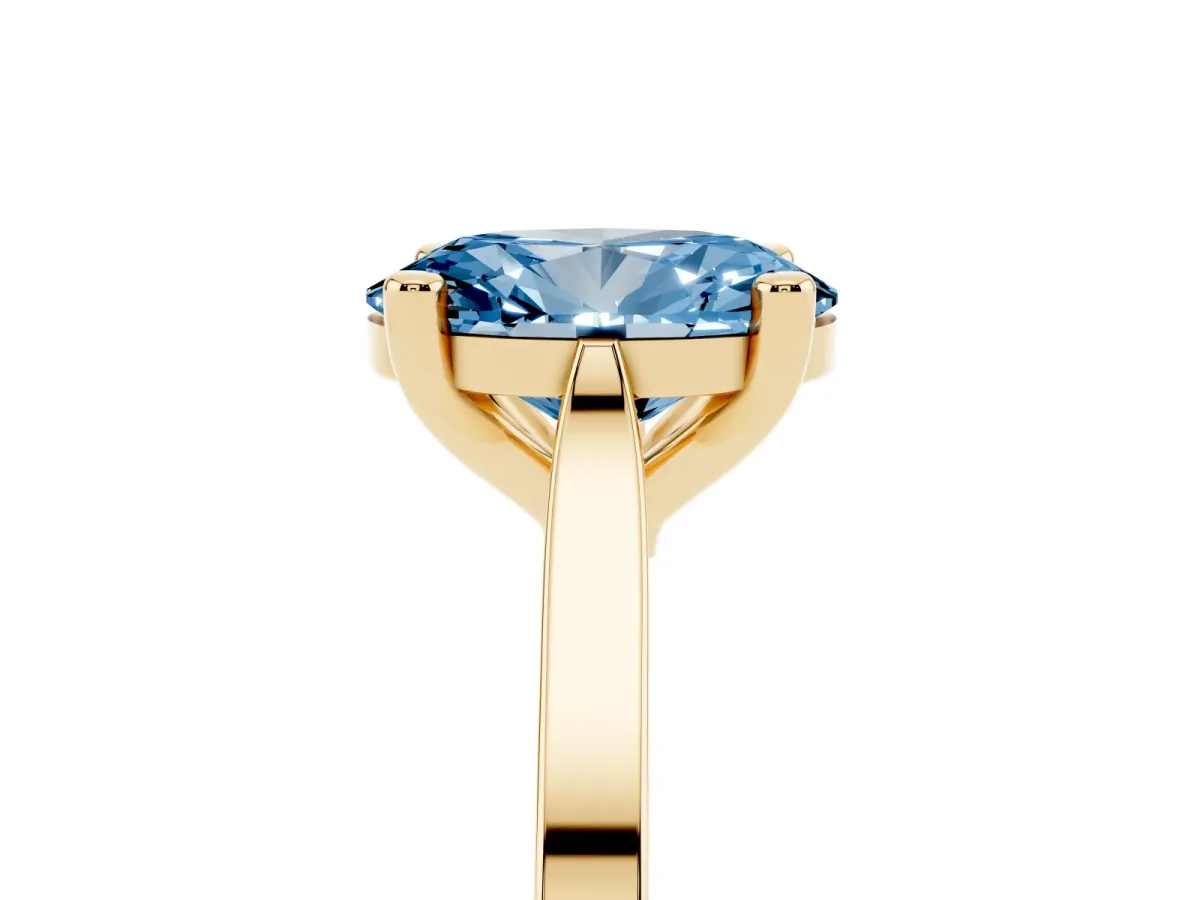 Fancy Blue Oval Cut Solitaire Diamond Ring with Four-Prong Setting and Tapered Band Yellow gold