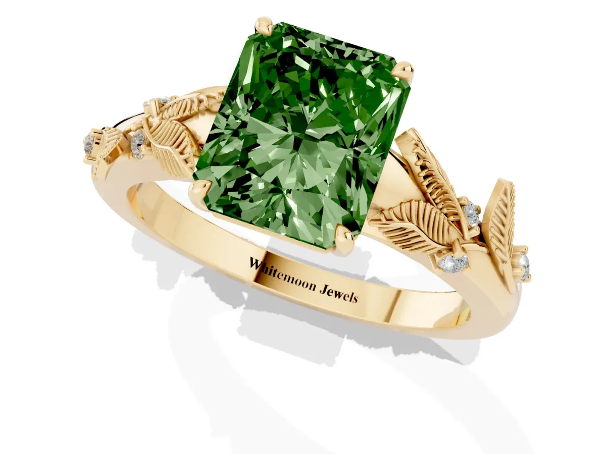 Fancy Green Radiant Cut Diamond Solitaire Ring with Leaf Motif Band and Four-Prong Setting Yellow gold