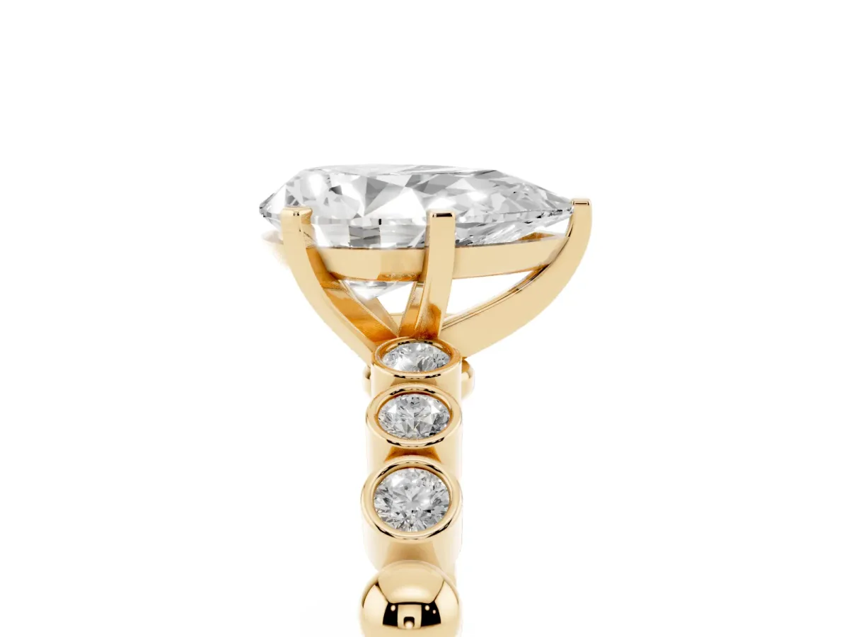Pear Cut Solitaire Bezel Accent Diamond Engagement Ring with Beaded Band and Four-Prong Setting Yellow gold