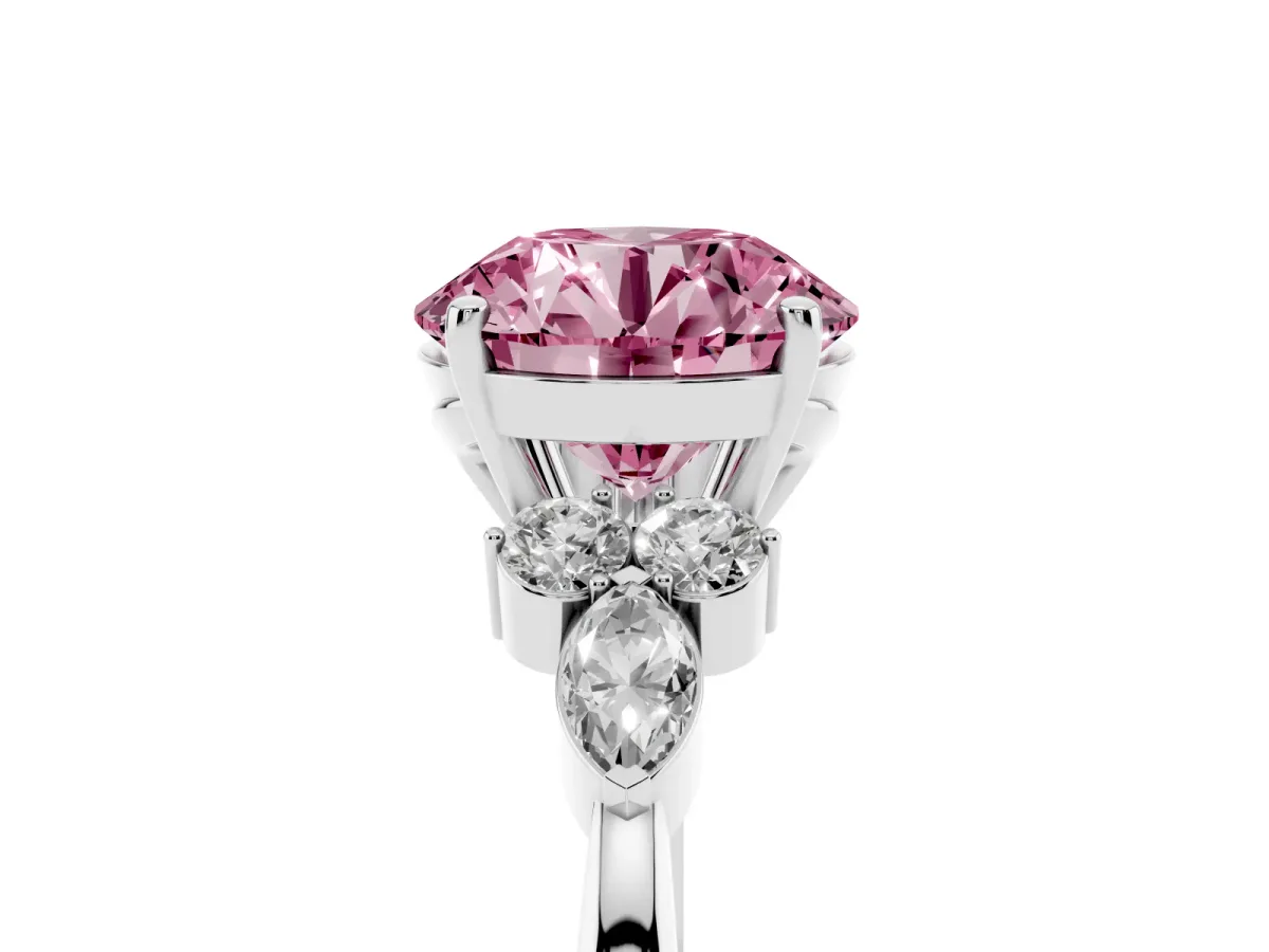 Fancy Pink Round Cut Brilliant Diamond Solitaire Ring with Pear Side Stones and Four-Prong Setting White gold