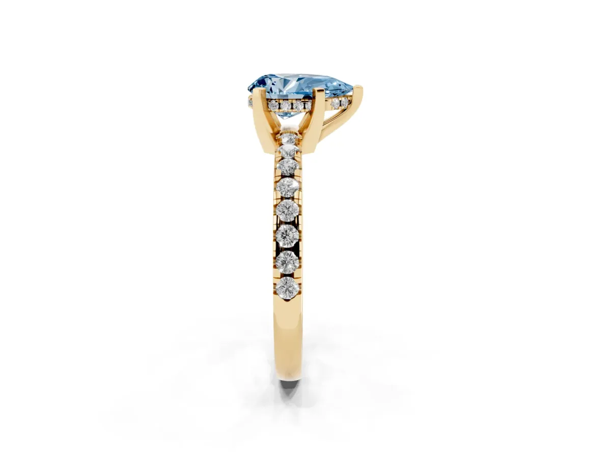 Fancy Blue Pear Cut Diamond Solitaire Ring with Round Pavé Band and Four-Prong Setting Yellow gold