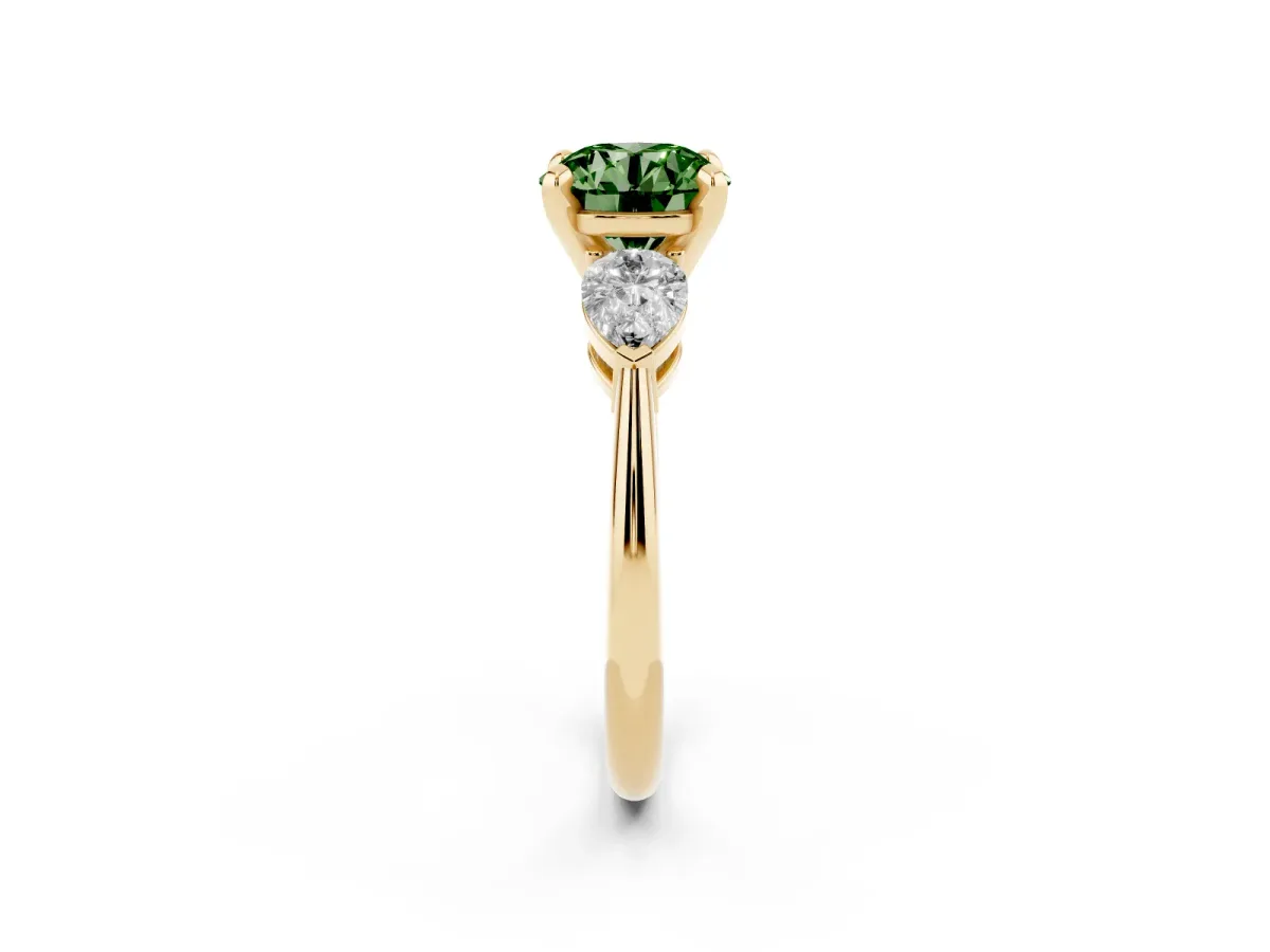 Fancy Green Three-Stone Round Cut Diamond Ring with Pear Side Stones and Four-Prong Setting Yellow gold