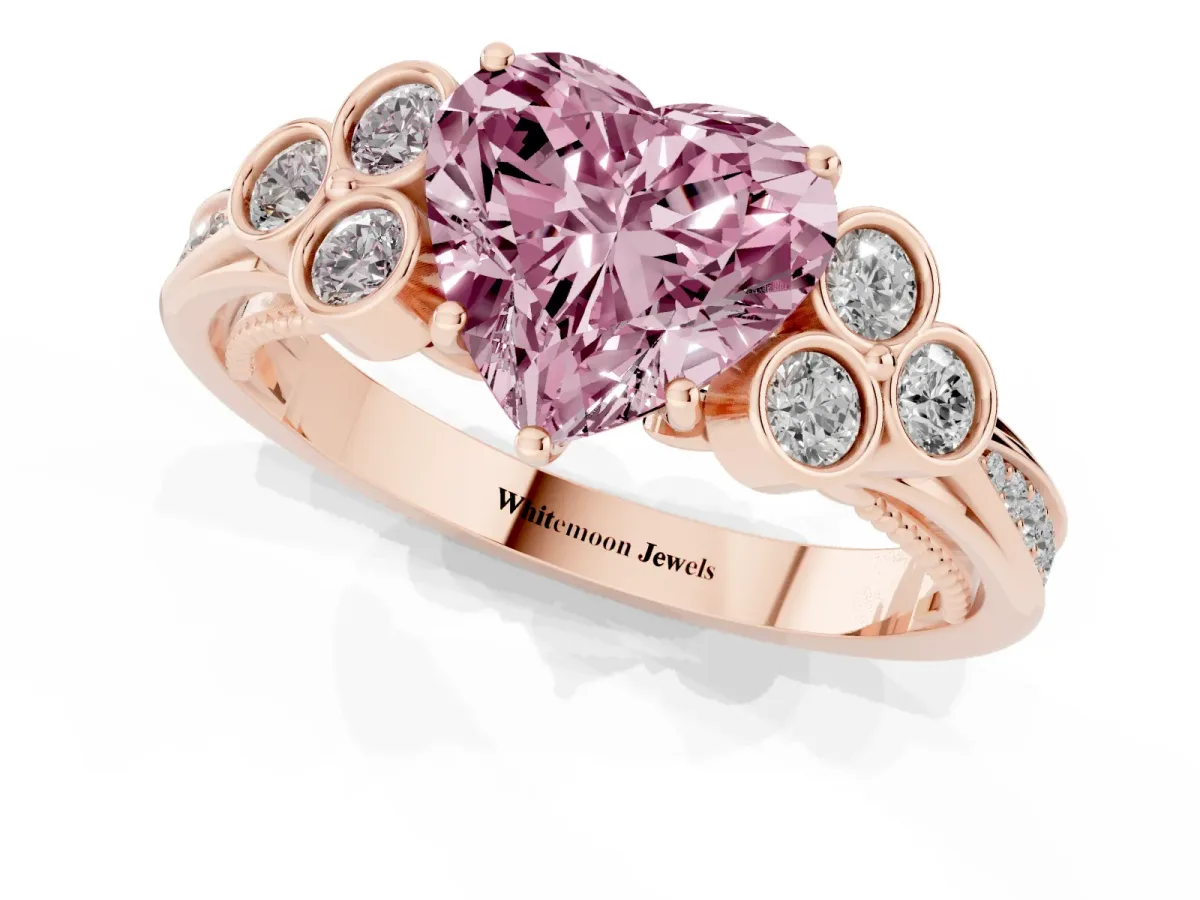 Fancy Pink Heart Cut Cut Diamond Engagement Ring with Bezel Set Round Side Stones and Prong Setting Rose gold