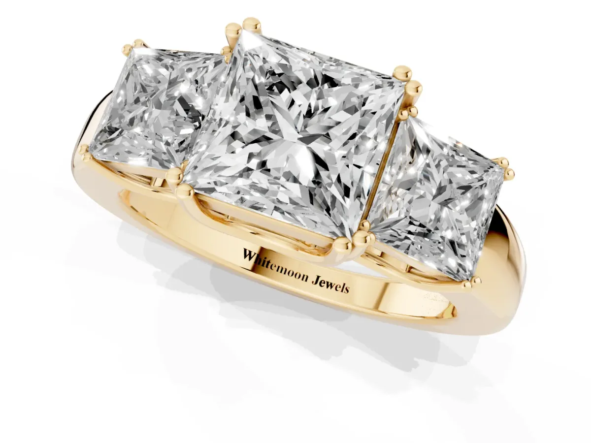 Three-Stone Princess Cut Cut Diamond Ring with Channel Set Band and Four-Prong Setting Yellow gold