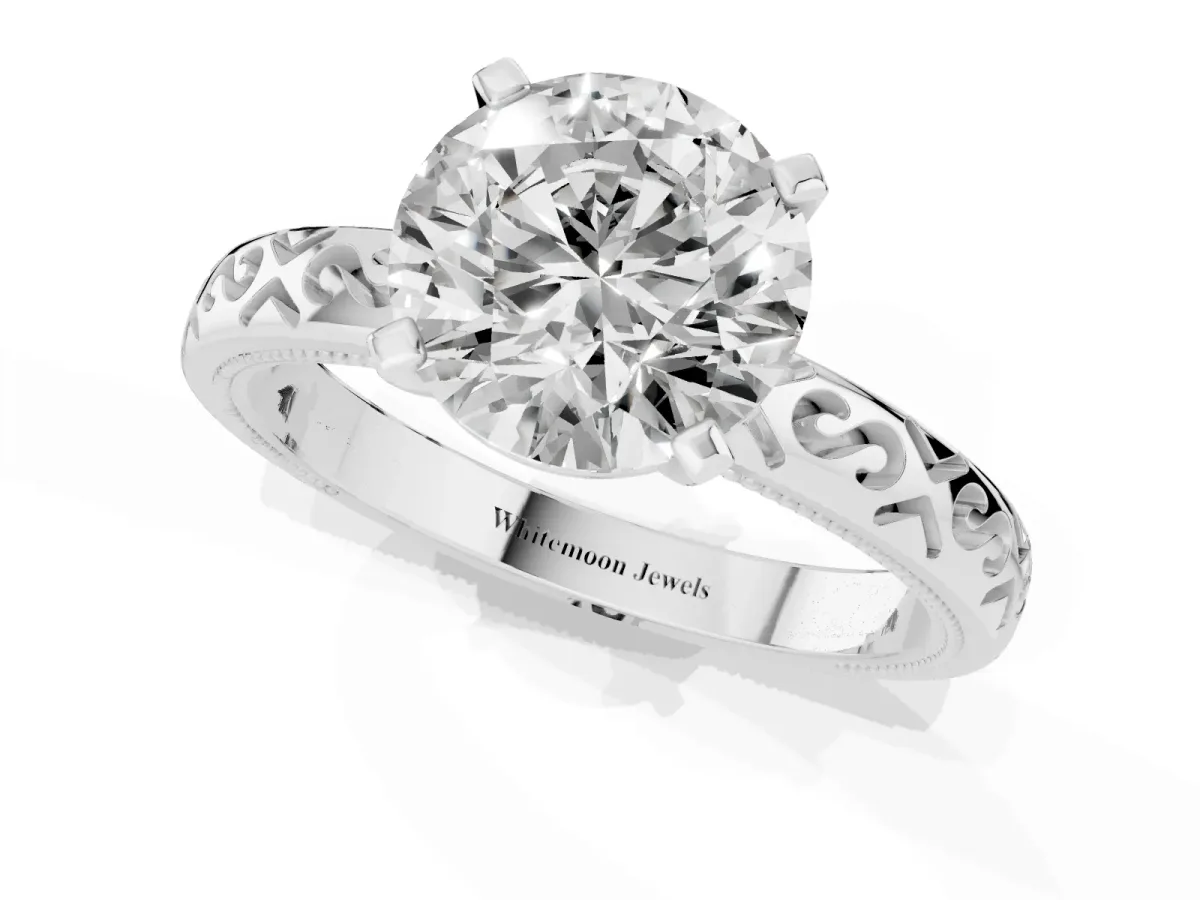 Round Cut Solitaire Engagement Ring with Scrollwork Band and Four-Prong Setting Silver