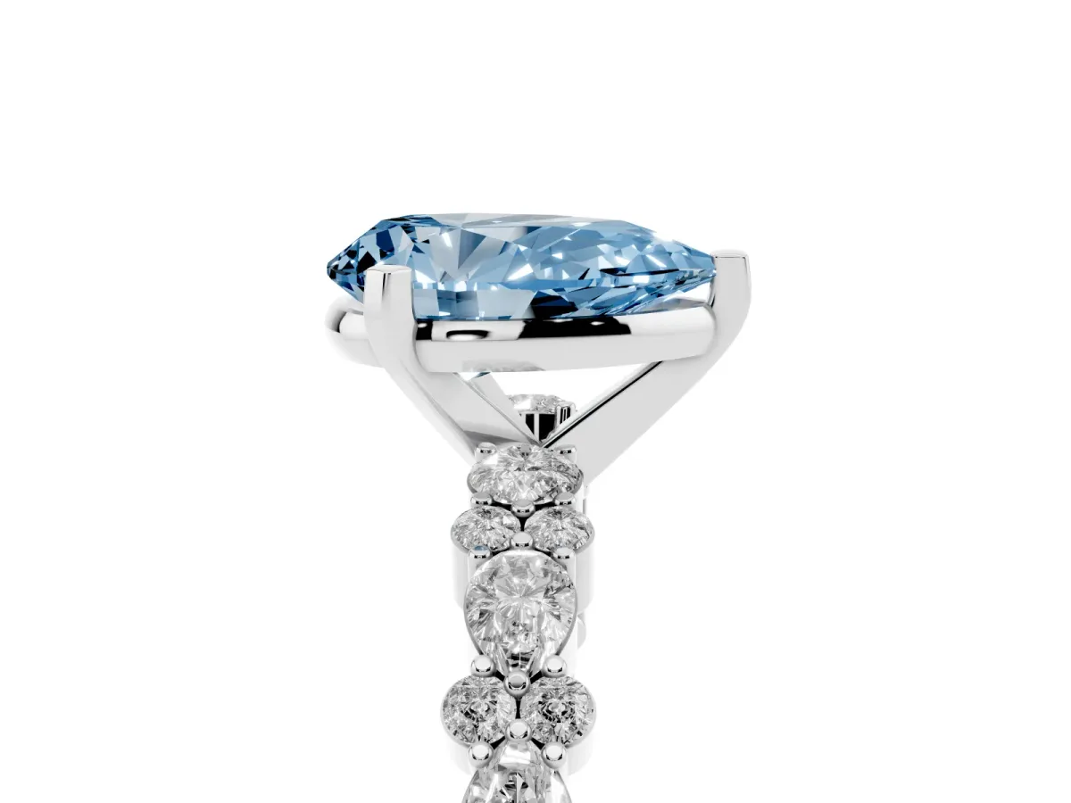 Fancy Blue Pear Cut Diamond Side Stone Solitaire Ring with Round and Four-Prong Setting White gold