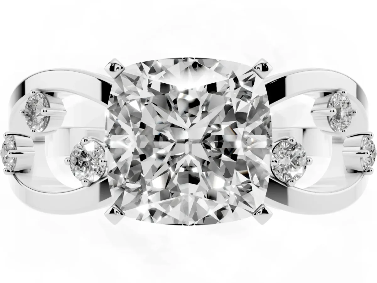 Cushion Cut Cut Solitaire Diamond with Side Stones on Criss-Cross Band and Four-Prong Setting Silver