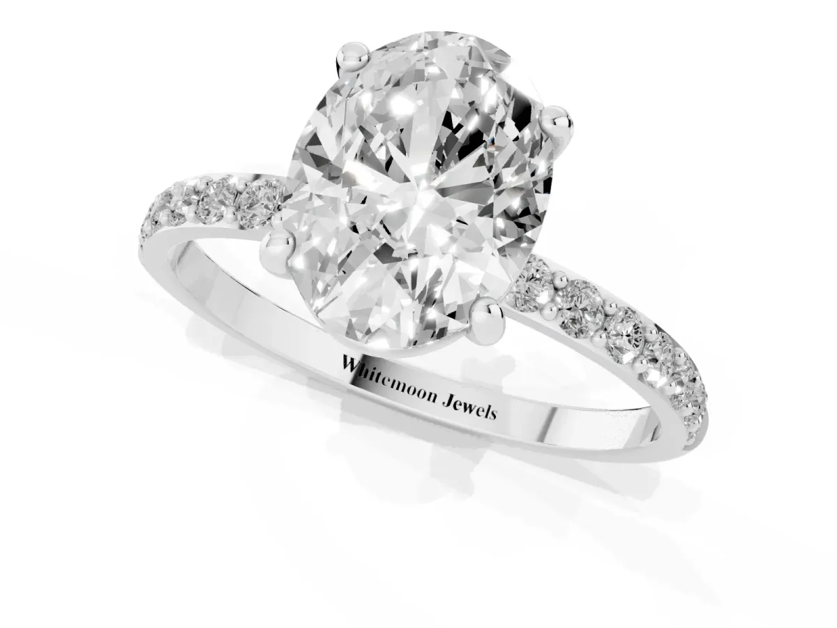 Oval Cut Diamond Solitaire Ring with Round Pavé Band and Prong Setting Silver