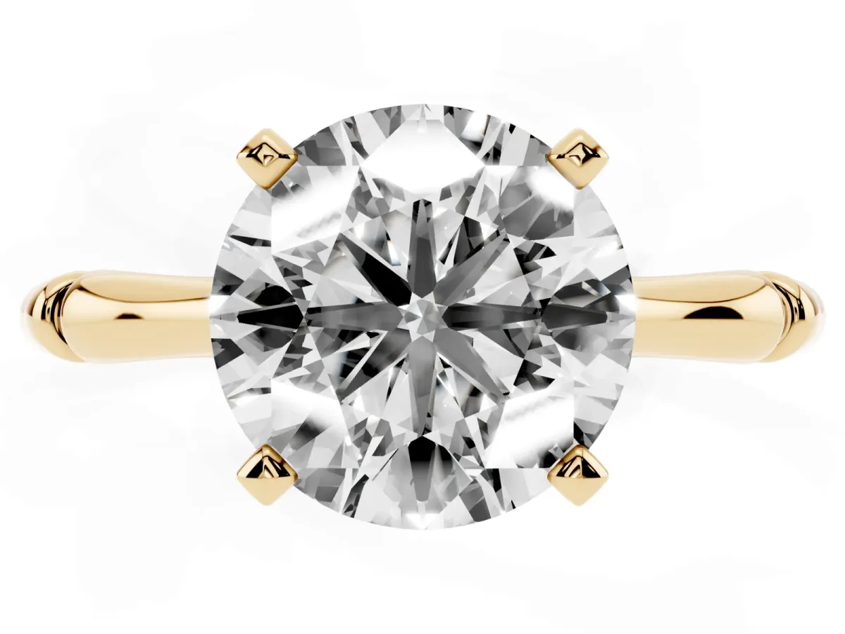 Round Cut Solitaire Diamond Ring with Bamboo Band and Four-Prong Setting Yellow gold