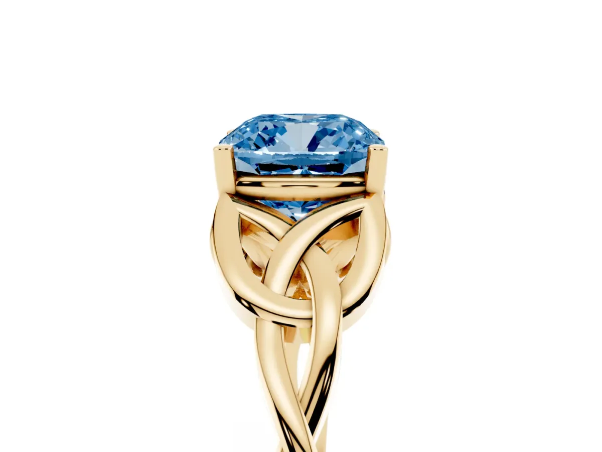 Fancy Blue Cushion Cut Diamond Solitaire Engagement Ring with Celtic Knot Band and Four-Prong Setting Yellow gold