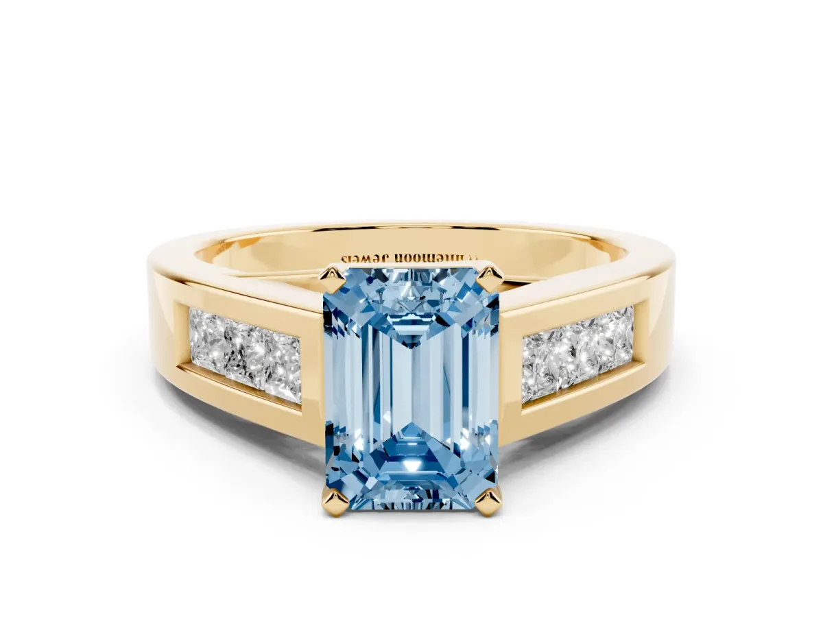 Fancy Blue Emerald Cut Cut Channel Set Solitaire Ring with Four-Prong Setting Yellow gold