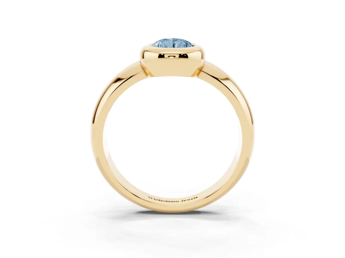 Fancy Blue Bezel Set Pear Cut Solitaire Ring with Wide Band Yellow gold