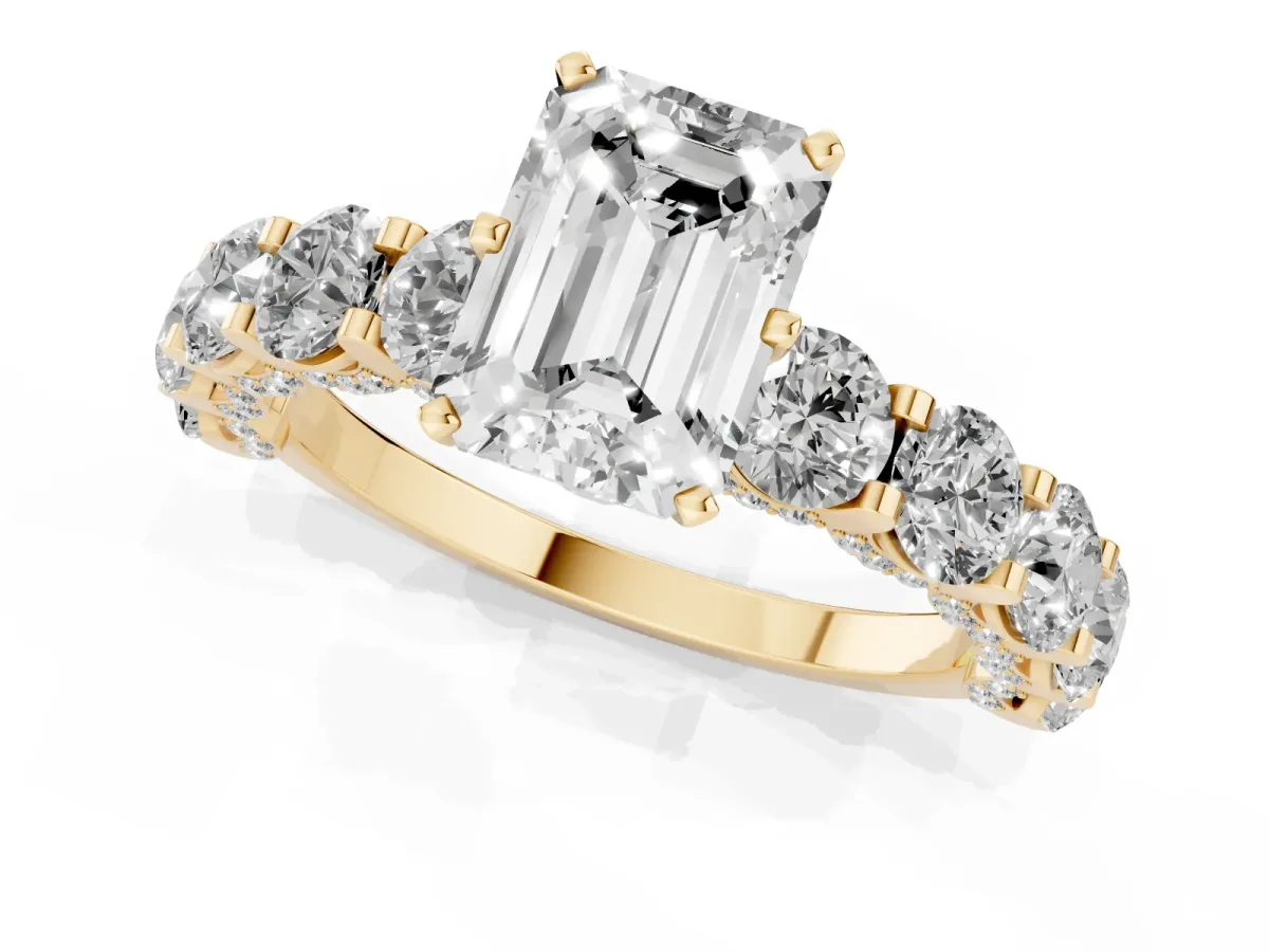 Emerald Cut Diamond Side Stone Engagement Ring with Four-Prong Setting Yellow gold