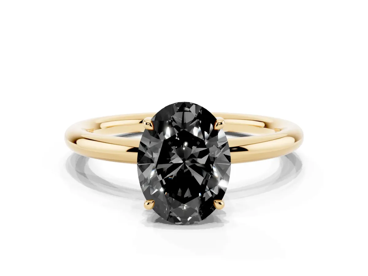 Fancy Black Oval Cut Diamond Solitaire Ring with Thin Band and Four-Prong Setting Yellow gold