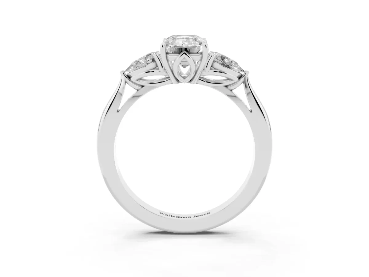 Emerald Cut Diamond Three-Stone Ring with Pear Side Stones and Prong Setting Silver
