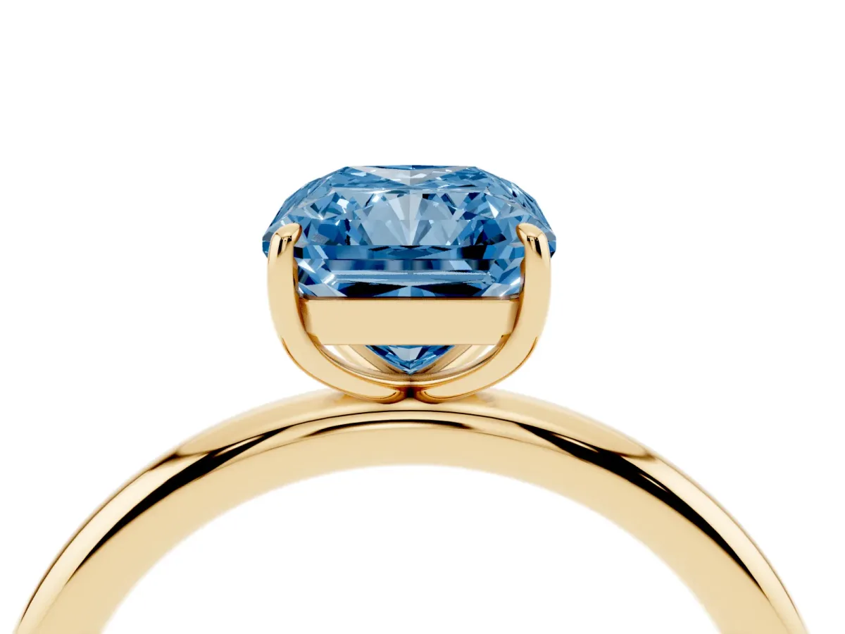 Fancy Blue Radiant Cut Solitaire Diamond Ring with Four-Prong Setting on a Plain Band Yellow gold