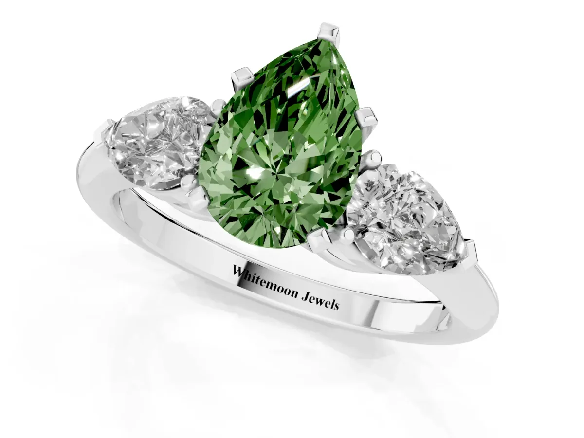 Fancy Green Three-Stone Pear Cut Diamond Ring with Pear Side Stones and Four-Prong Setting Platinum