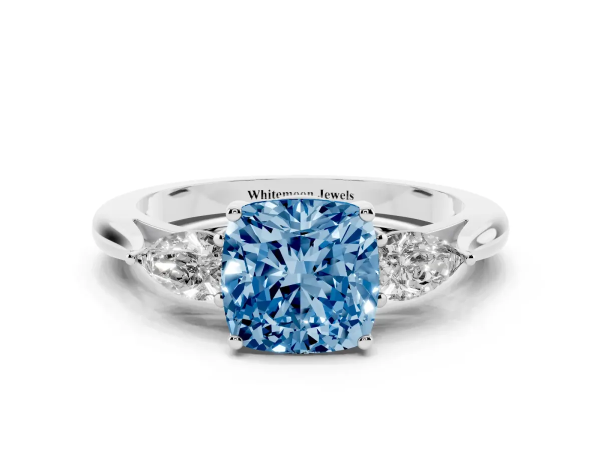 Fancy Blue Three-Stone Cushion Cut Diamond Ring with Pear Side Stones in Four-Prong Setting Silver