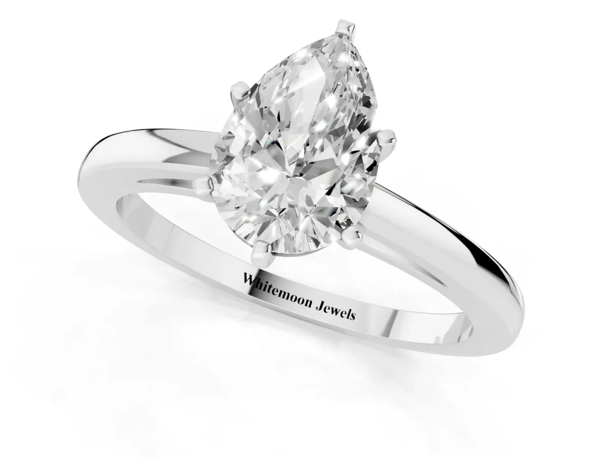 Pear Cut Solitaire Diamond Engagement Ring with Four-Prong Setting on a Classic Band White gold
