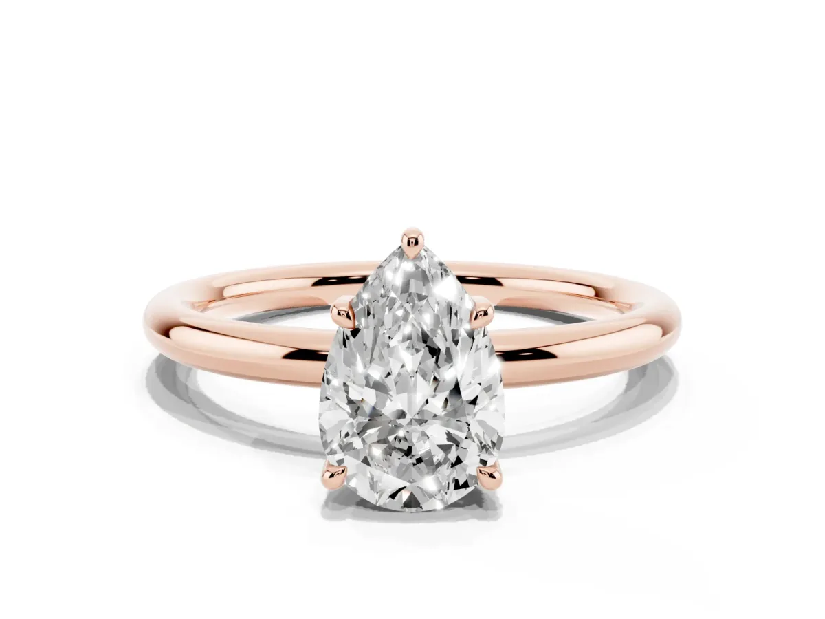 Pear Cut Diamond Solitaire Ring with Thin Band and Four-Prong Setting Rose gold