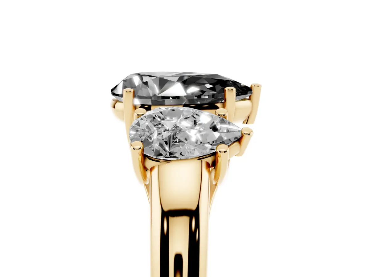 Fancy Black Three-Stone Pear Cut Diamond Engagement Ring with Prong Setting Yellow gold
