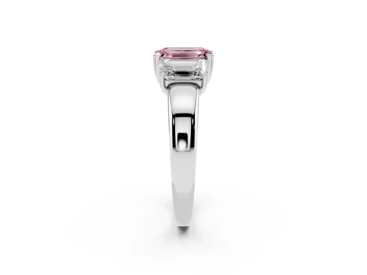 Fancy Pink Three-Stone Emerald Cut Cut Diamond Ring with Channel Set Band and Four-Prong Setting Silver