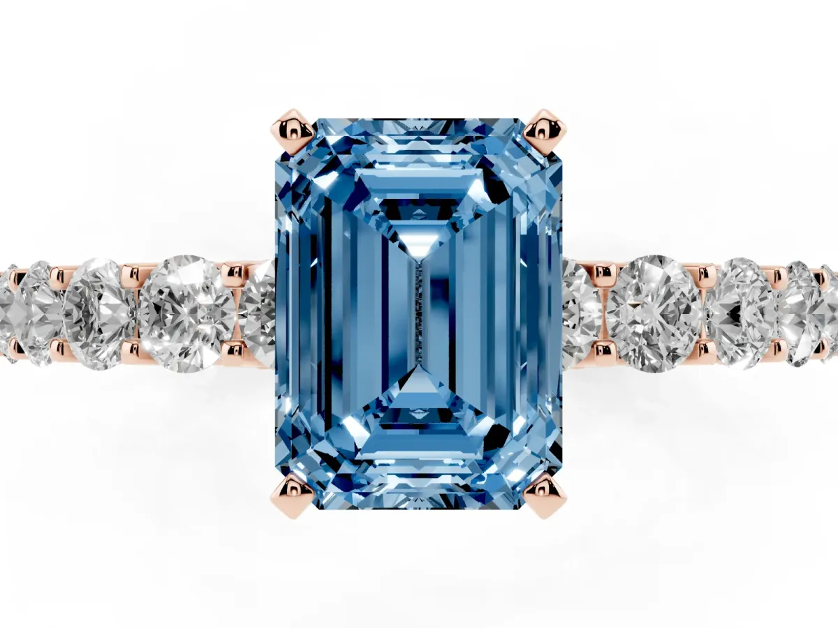 Fancy Blue Emerald Cut Diamond Solitaire Ring with Shared Prong Pavé Band and Four-Prong Setting Rose gold